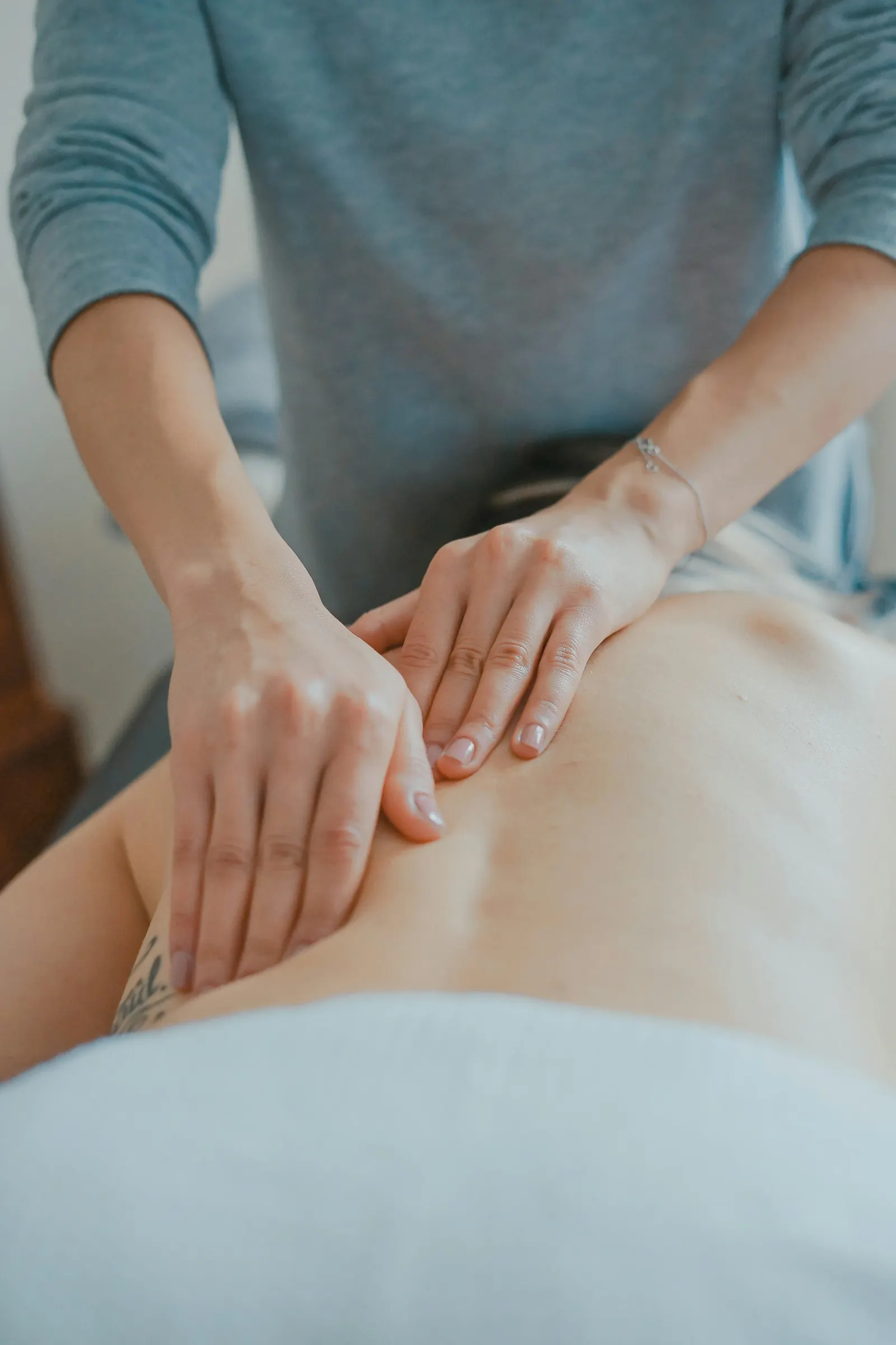 A therapist giving a relaxing back massage